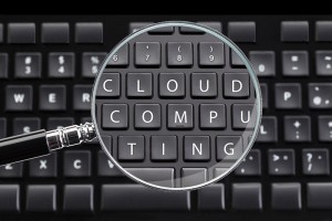 CLOUD COMPUTING written on keyboard with magnifying glass