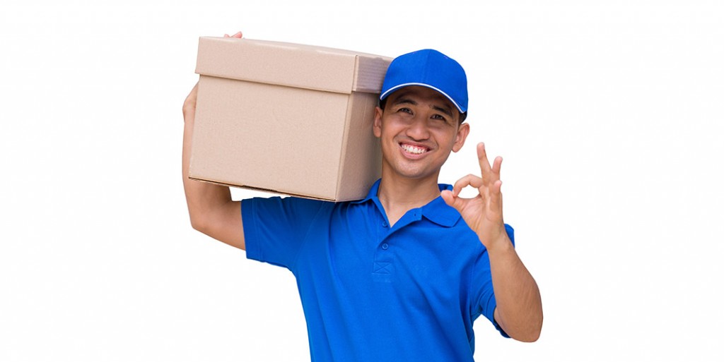 Asian delivery man carrying a parcel box and giving OK sign